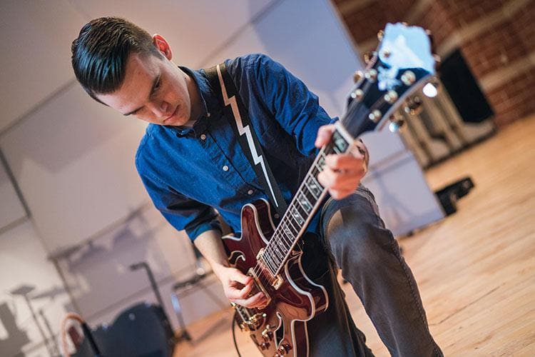 Matt Meyrick playing guitar