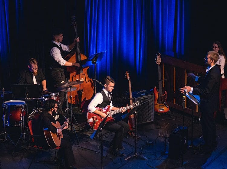 This year’s concert will feature the musical talents of Trinity’s Jazz Ensemble—a group of student instrumentalists—and the Kevin Brown Quartet—a professional jazz band from the Chicago area.
