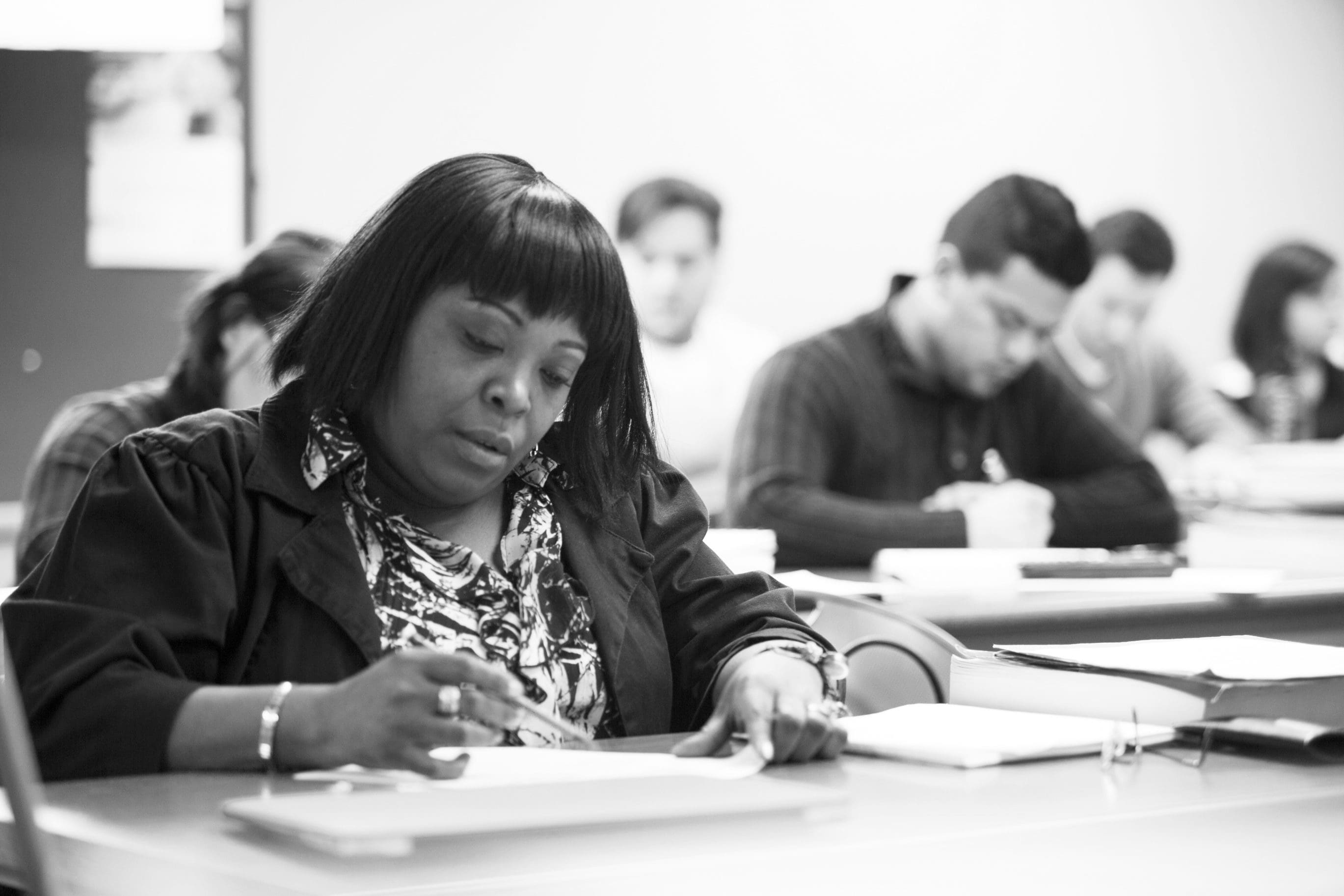 Adult Undergraduate students studying in class