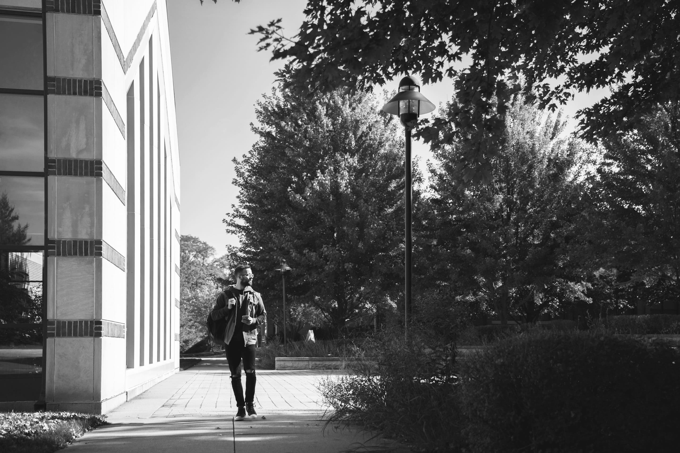 Student walking through amphitheater