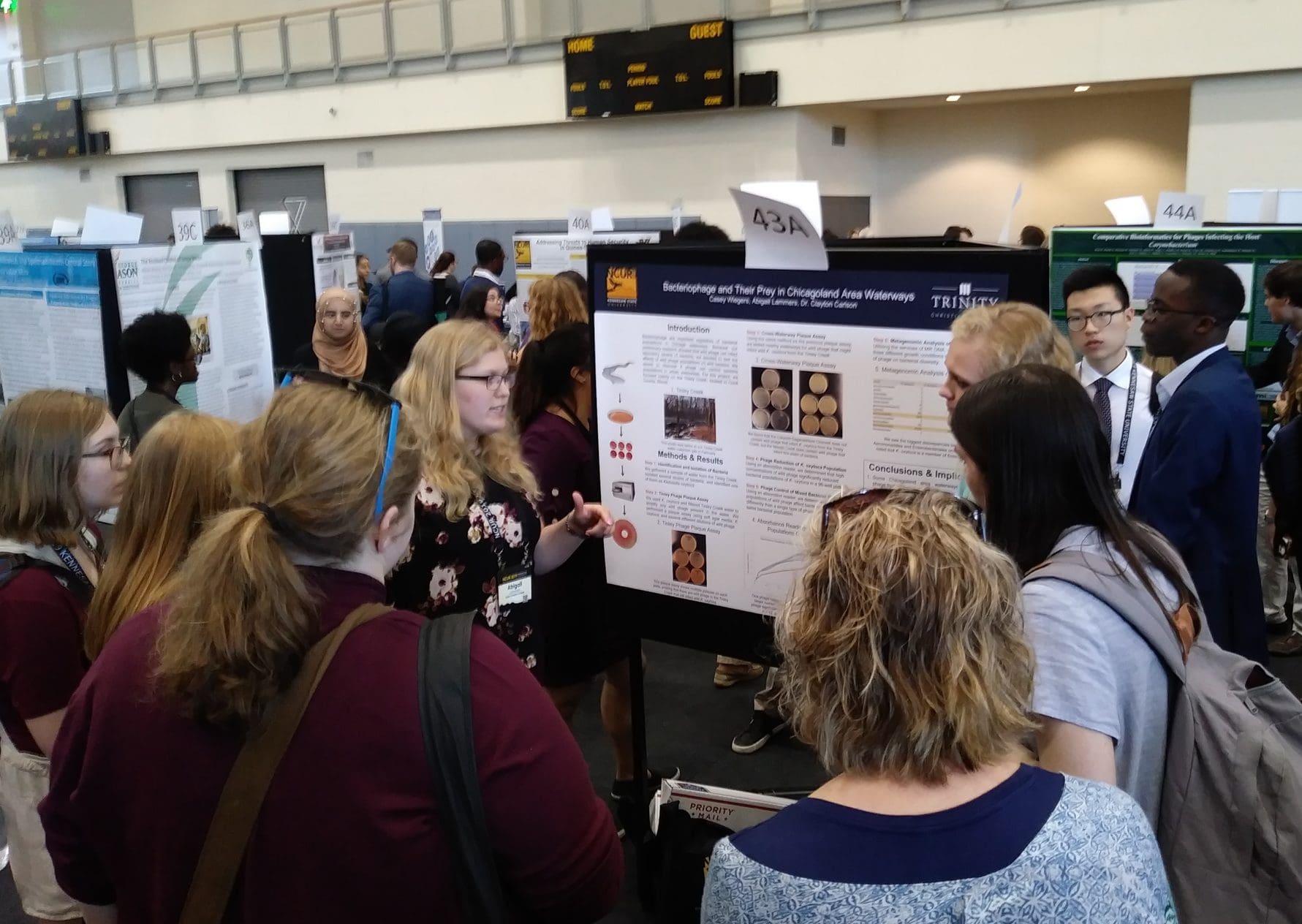 Students giving poster presentation at NCUR in Atlanta