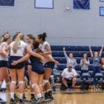 Volleyball team in huddle