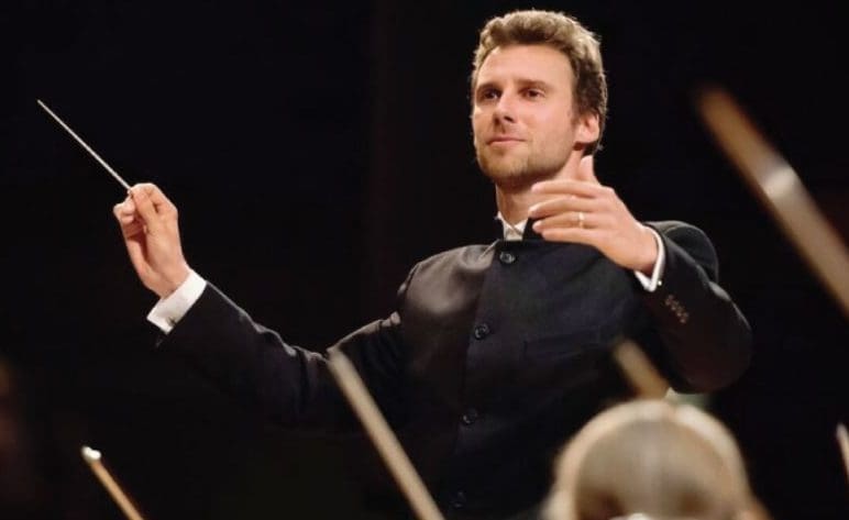 Conductor conducting an orchestra