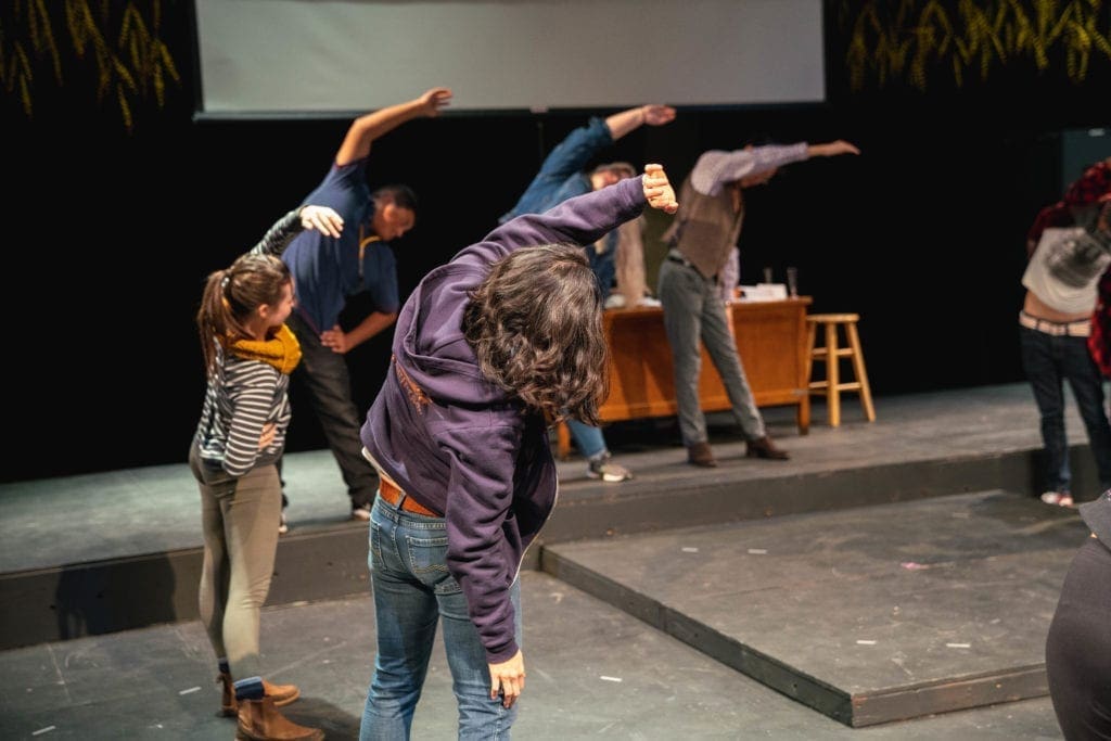 Theatre Workshop - theatre cast stretching out before performance