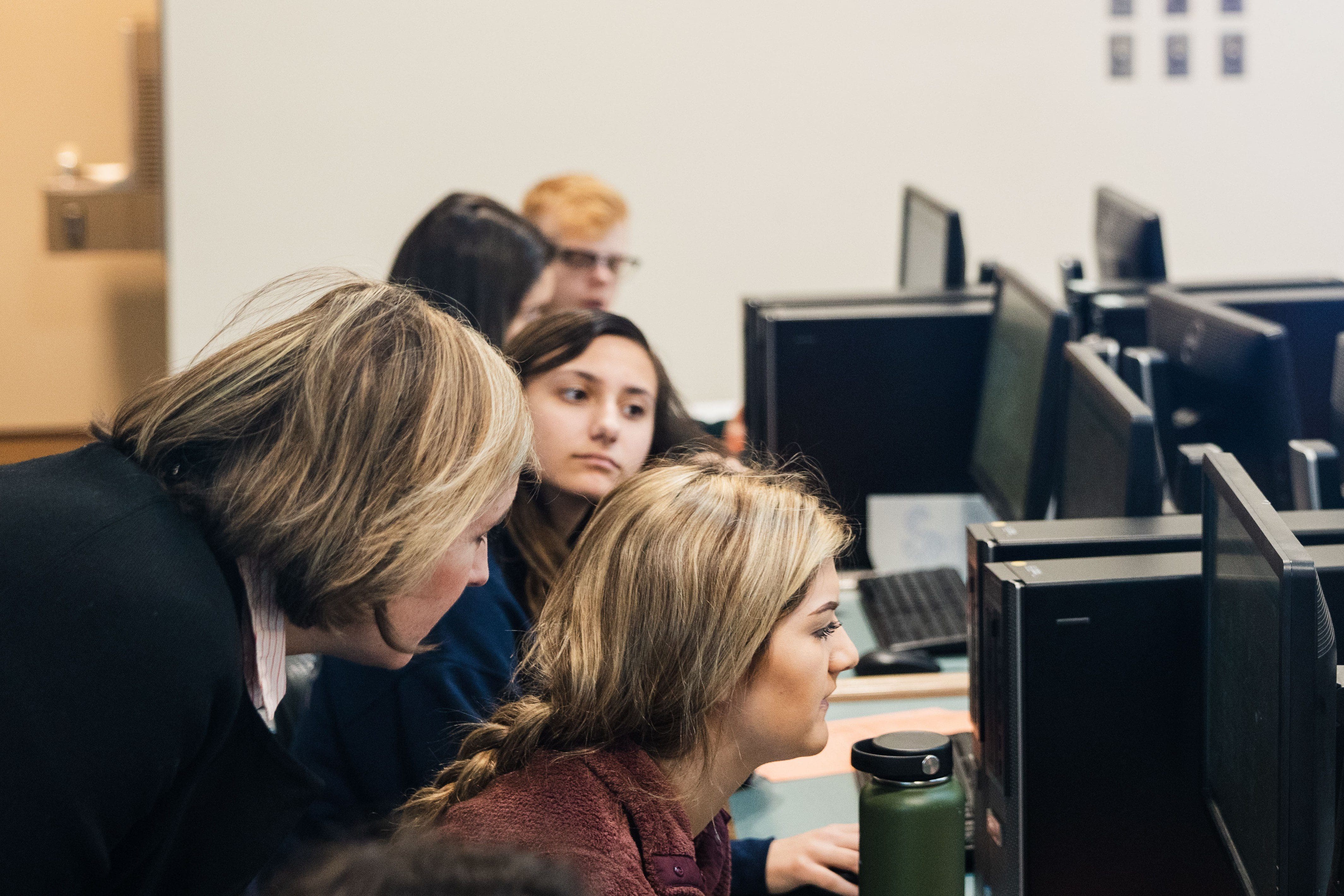 students doing research in the library