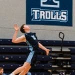 men's volleyball versus Goshen 2020: payer jumping up to spike the ball