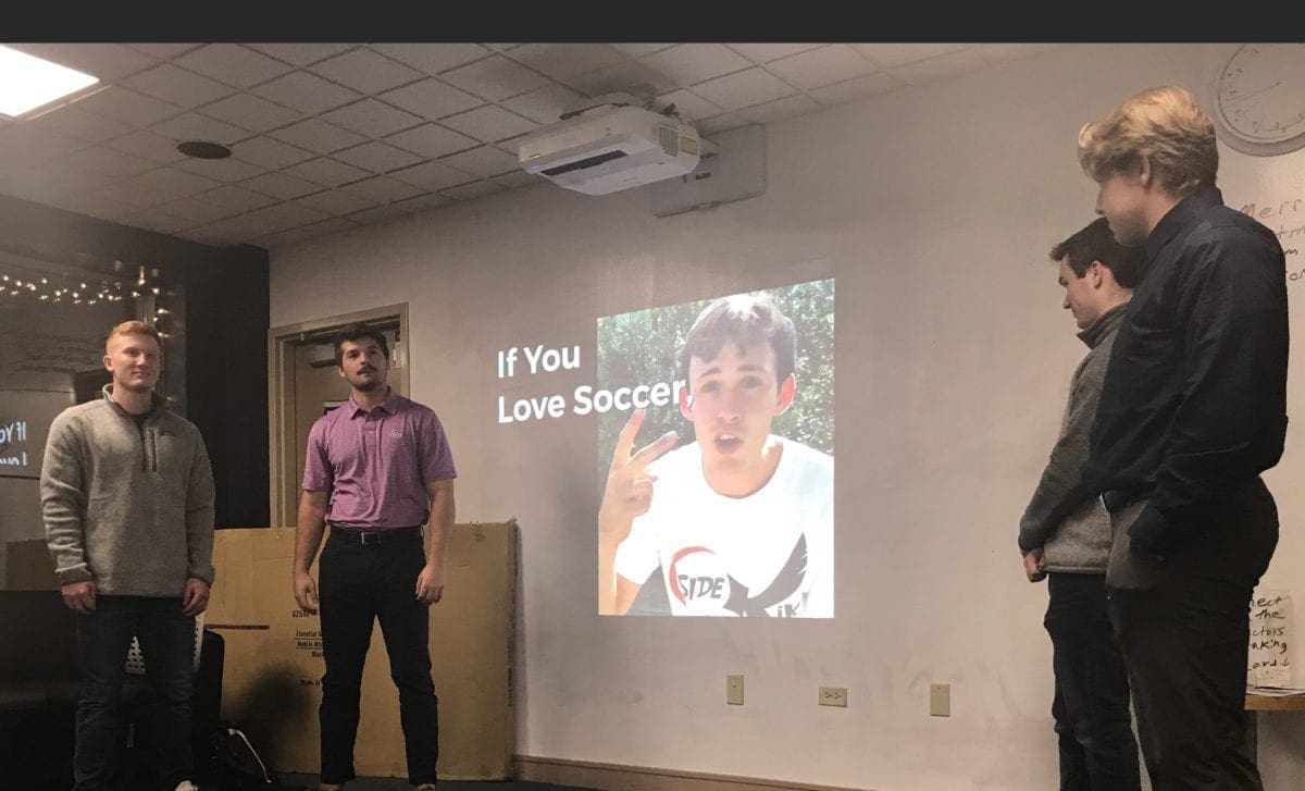Students giving marketing plan presentation