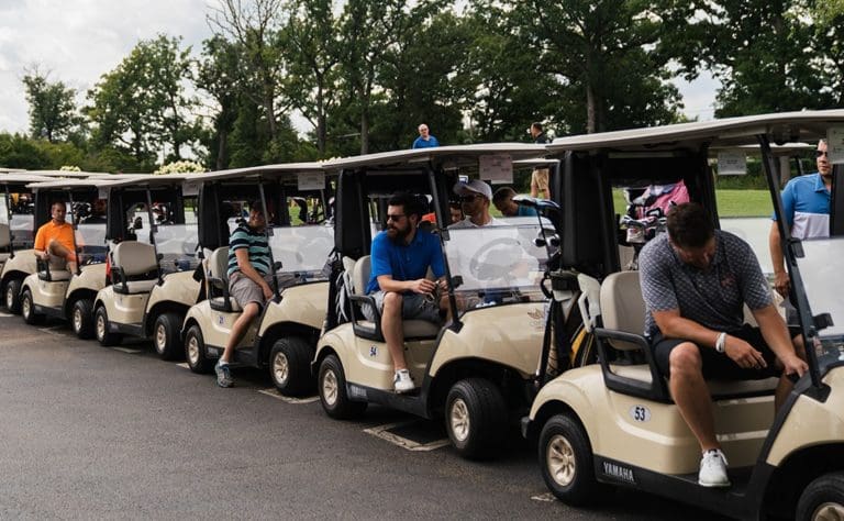 Golfers in golf carts