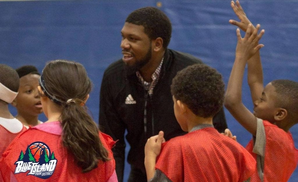 Joshua Edwards ‘15 coaching students at the Blue Island Park District. Photo by Blue Island Park District