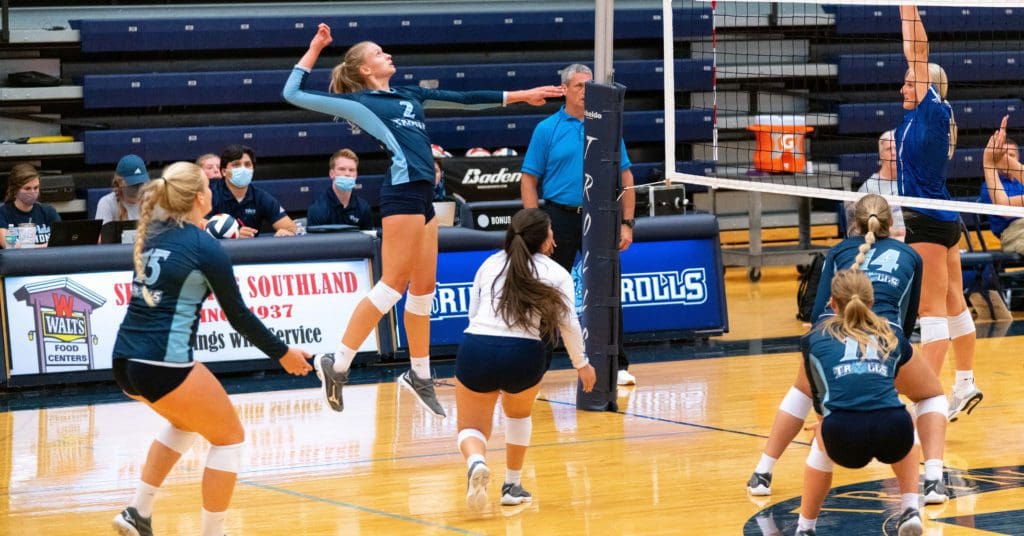women's volleyball - player jumping up for a spike