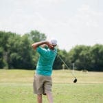 Alumni Golf Outing - golfer at the driving range