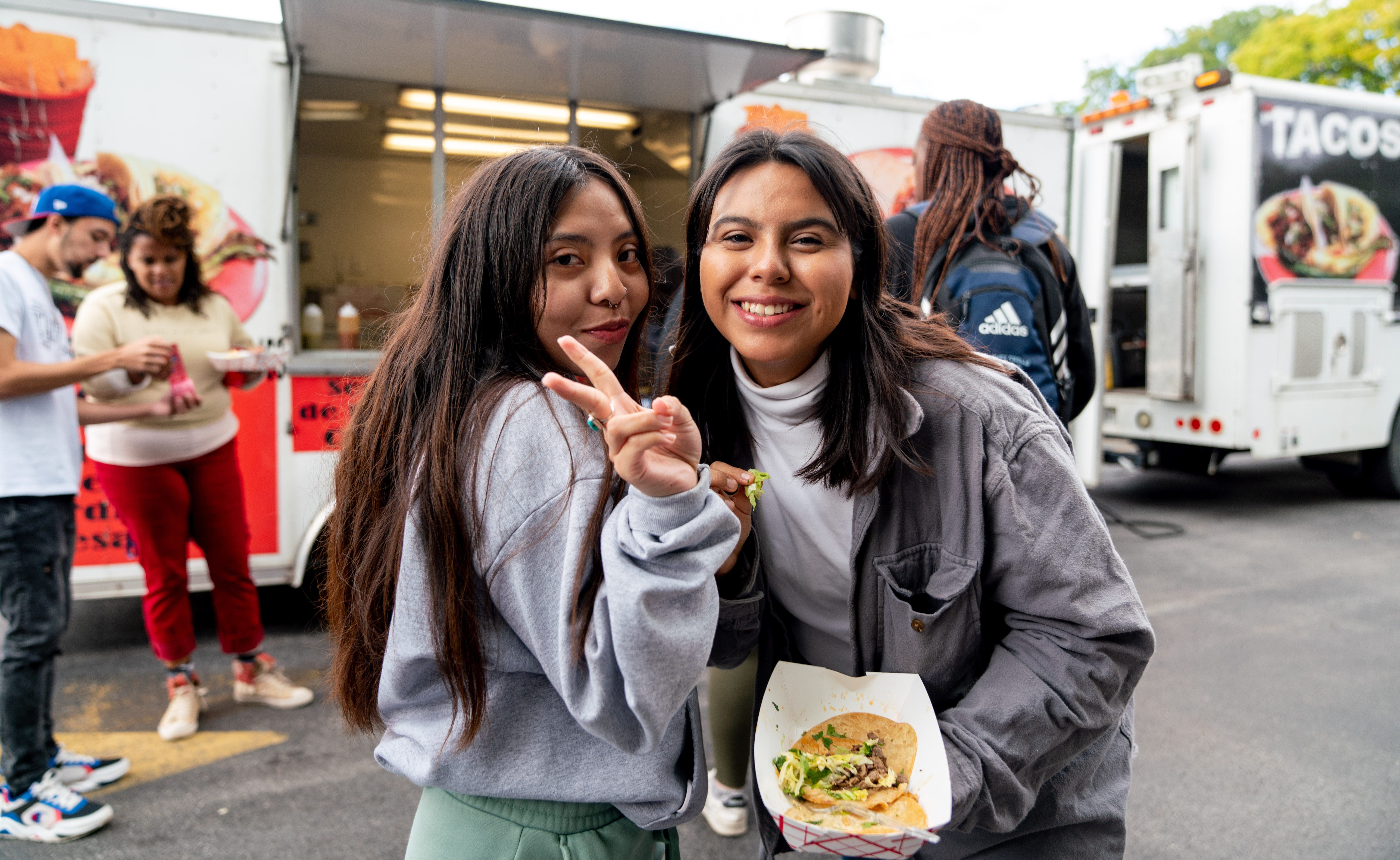 Sabor Latino club - students enjoying food from a taco truck