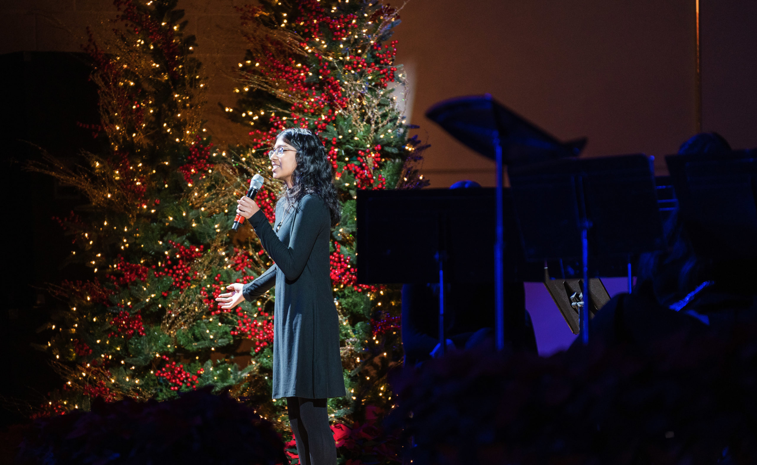 Christmastide - student speaking on stage