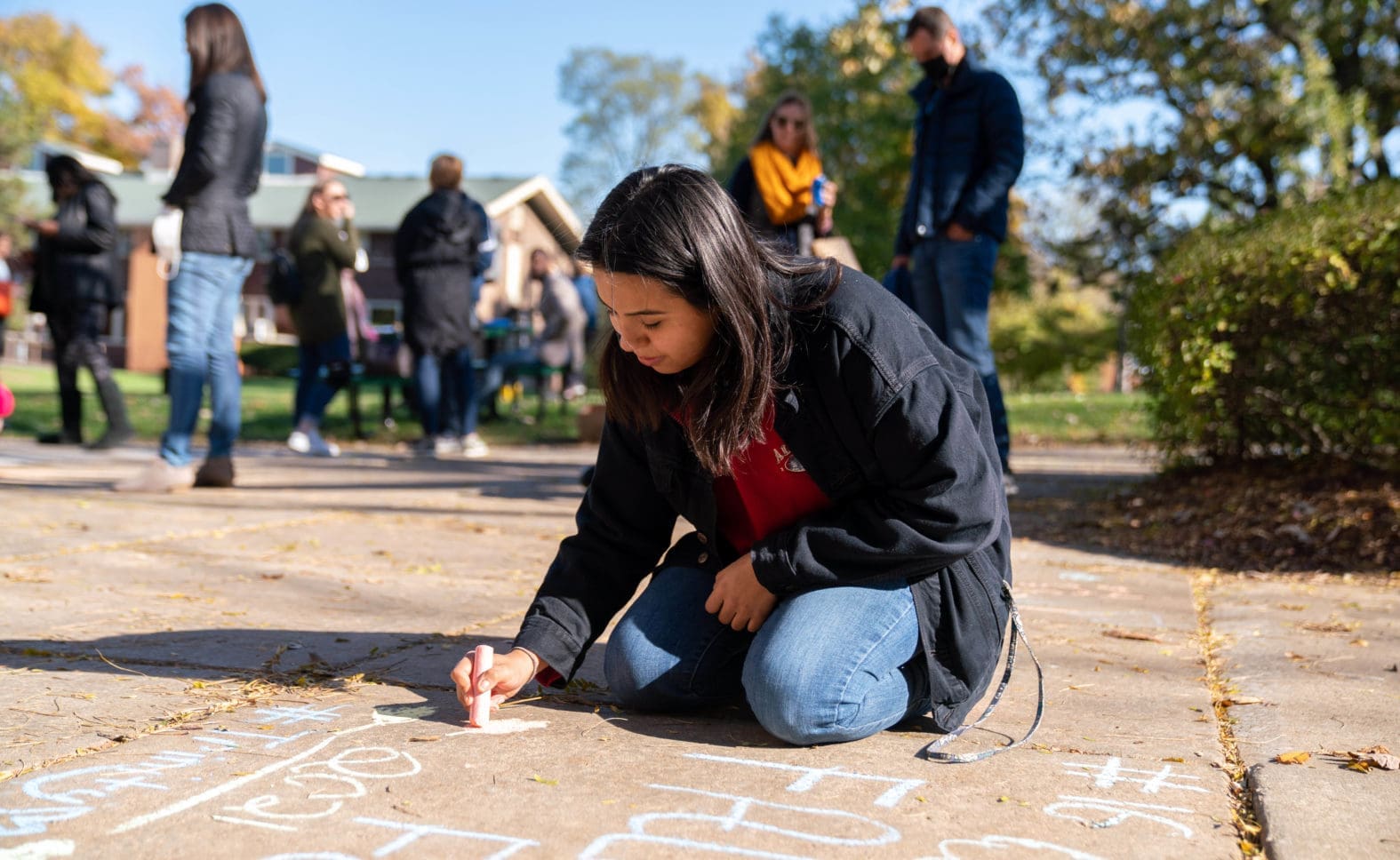 Fall Fest: Chalk the Walk - students drawing with chalk