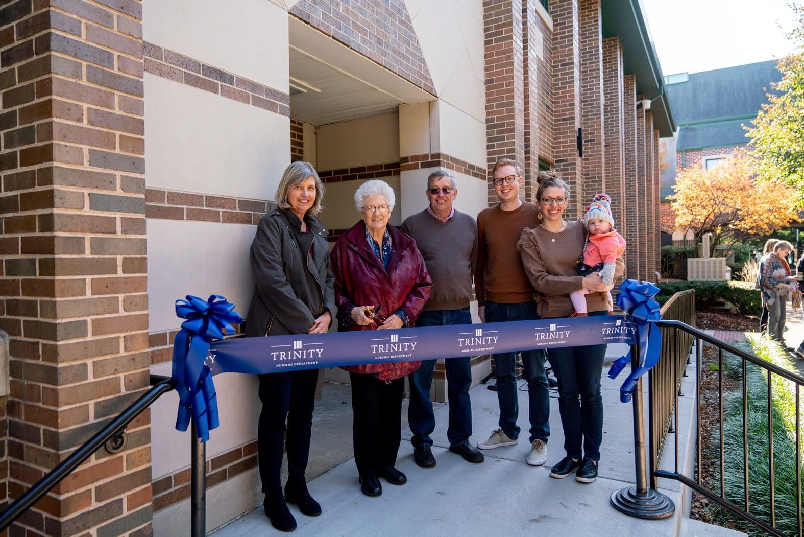 Fall Fest: Ribbon cutting ceremony outside classroom building