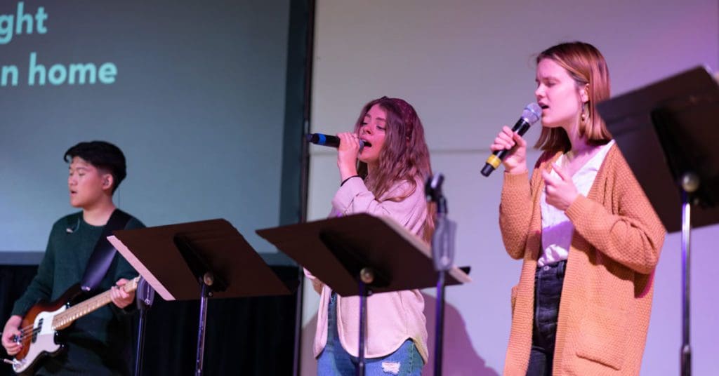 Chapel Service - student worship leaders performing on stage for Chapel