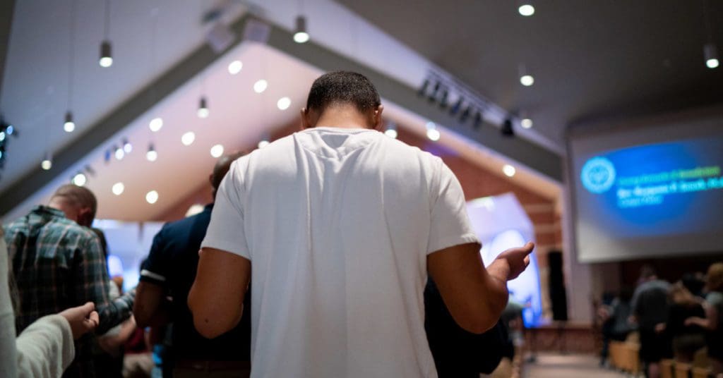 Maundy Thursday: student praying inside of the Chapel