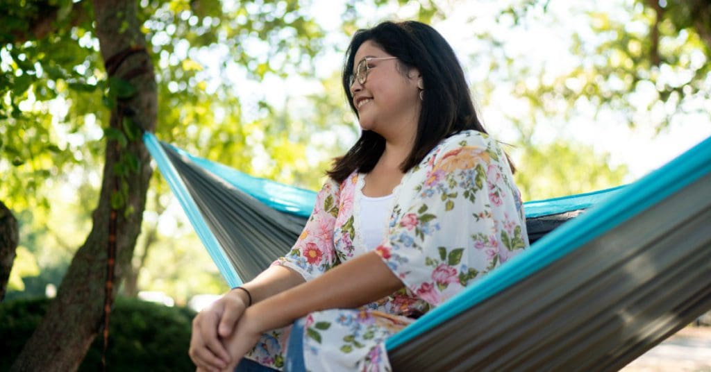 Spring Break: student enjoying the nice weather in their hammock