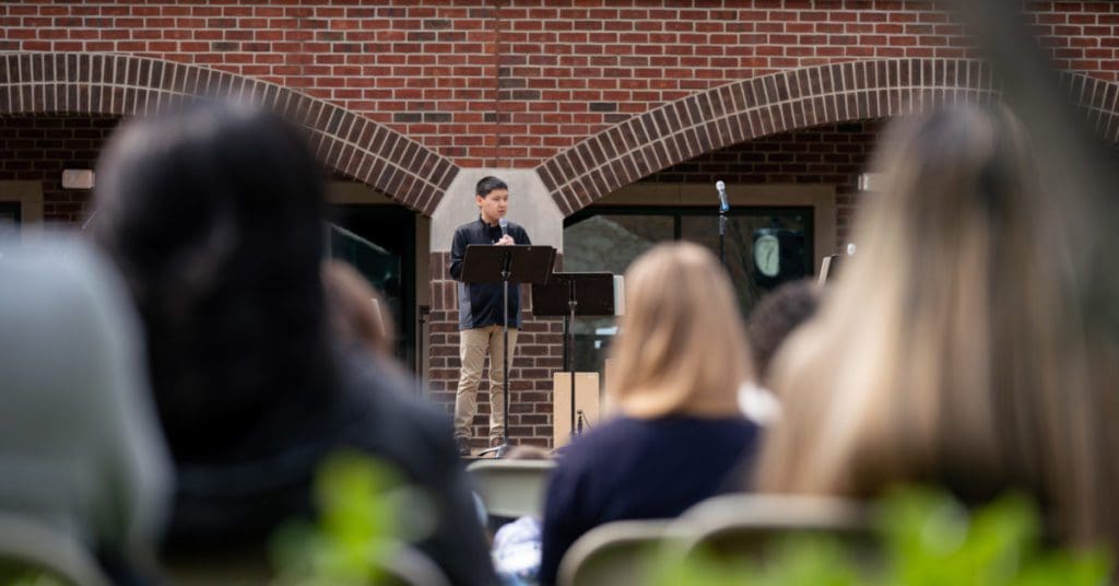 Easter Monday: Pastor Ben preaching outside