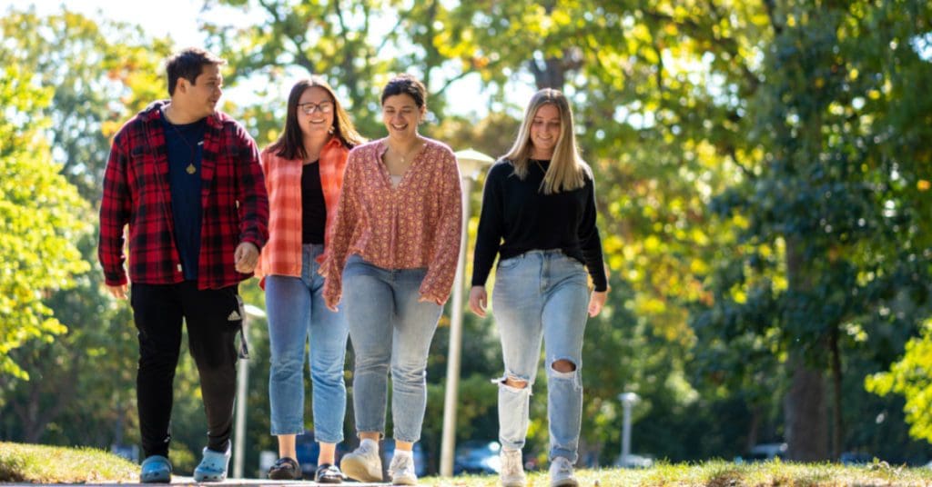 Thanksgiving Break: Group of students walking on sidewalk