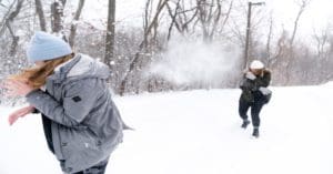 Winter Break - students having a snowball fight