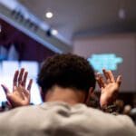 Trinity students worshipping in the chapel