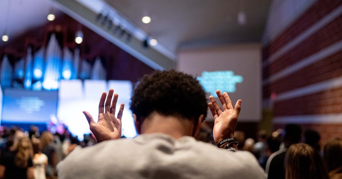 Trinity students worshipping in the chapel